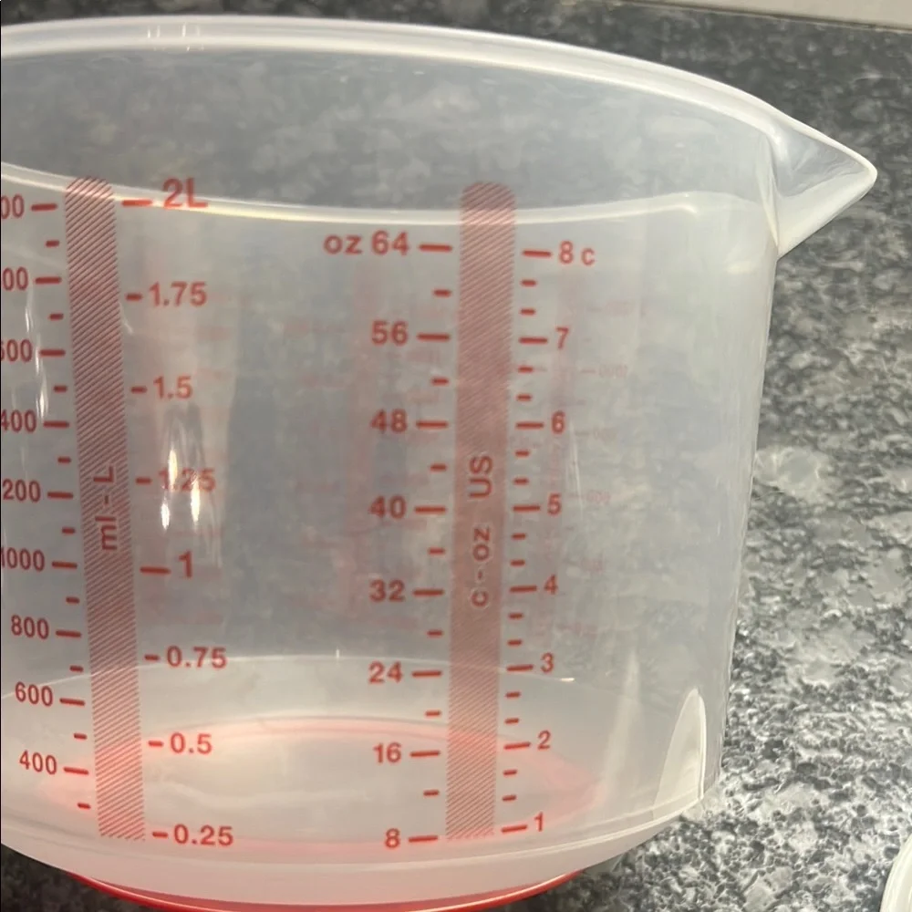 Tupperware Mix n Store Red and White Measuring cup. New without tags